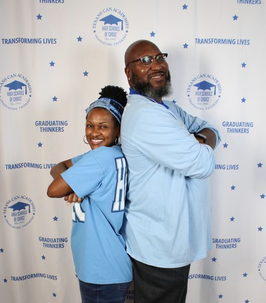 Two staff standing back-to-back